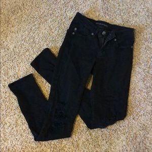 Black distressed Skinny jeans.